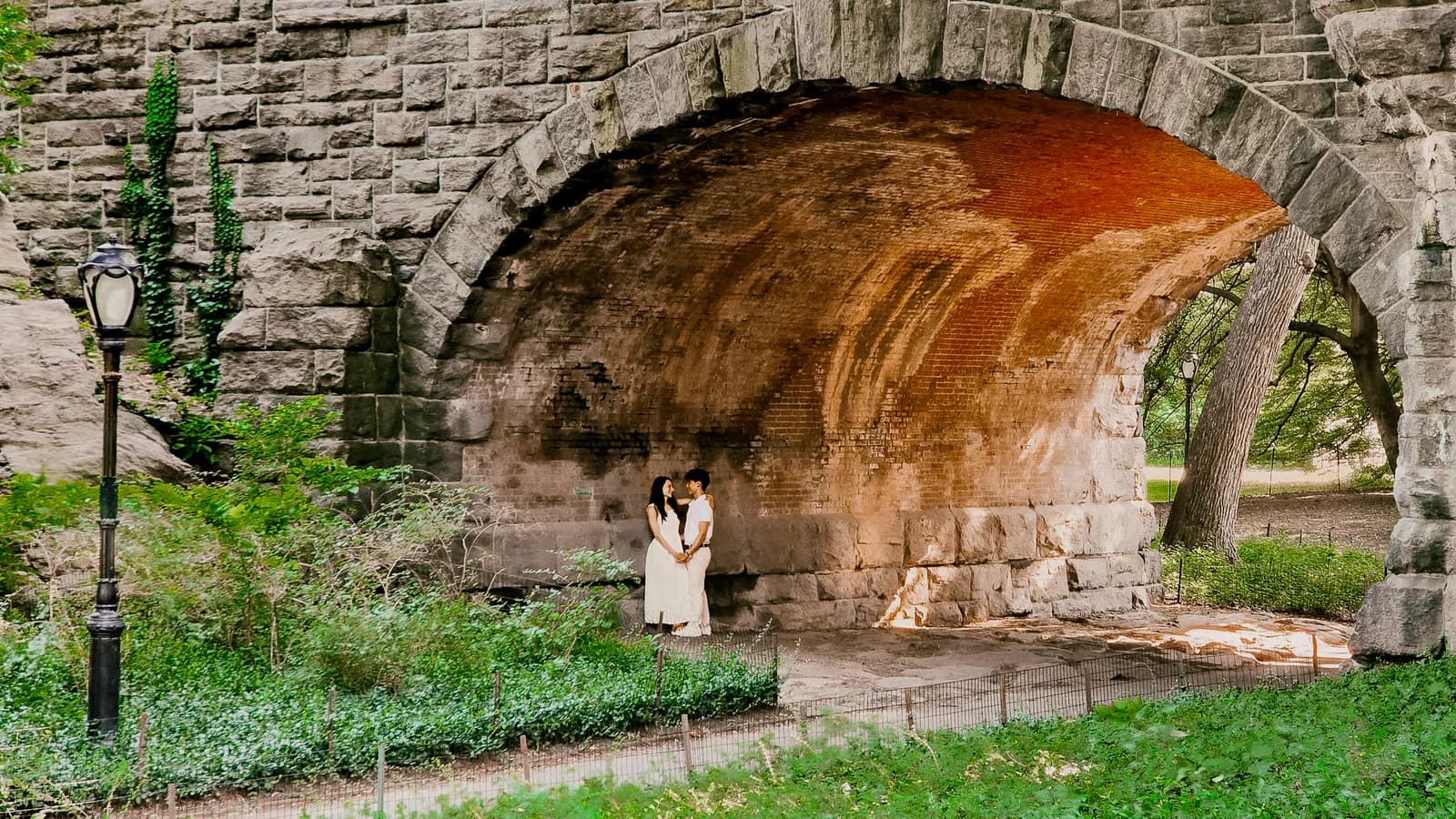 The couple together in a wide scenic landscape