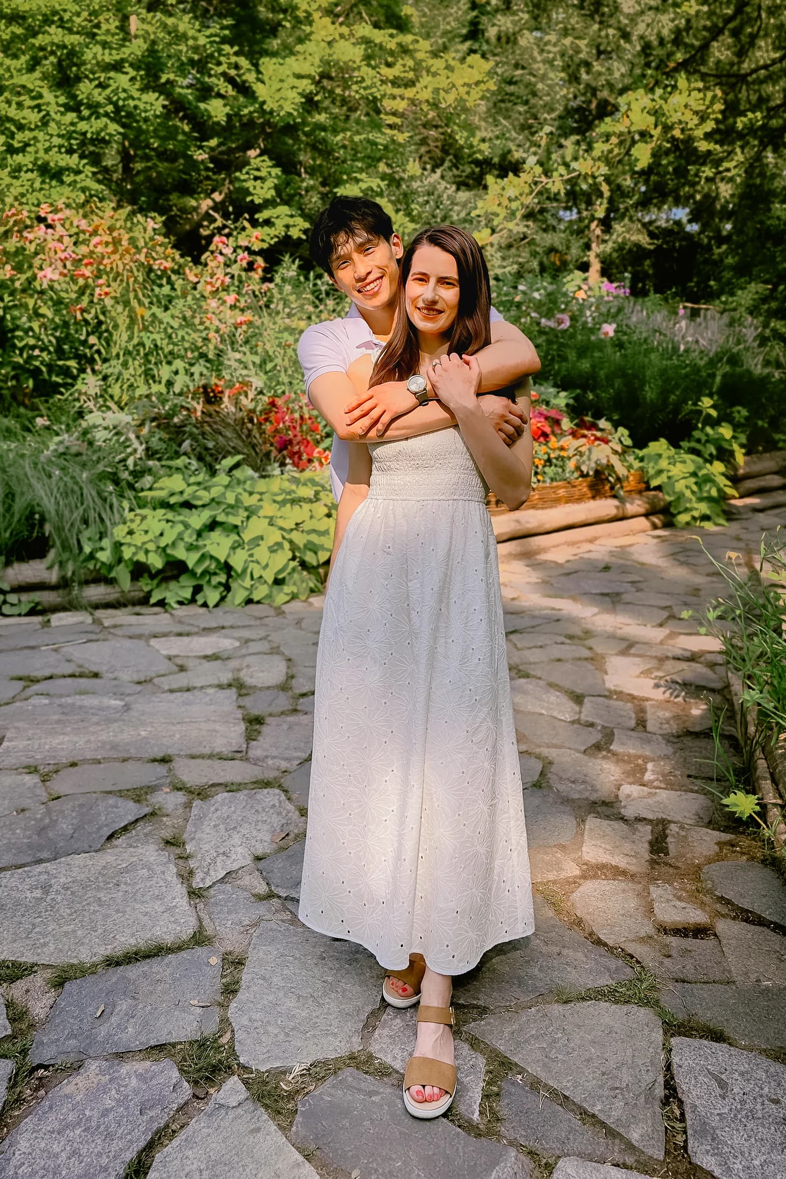 The couple in a tall outdoor portrait