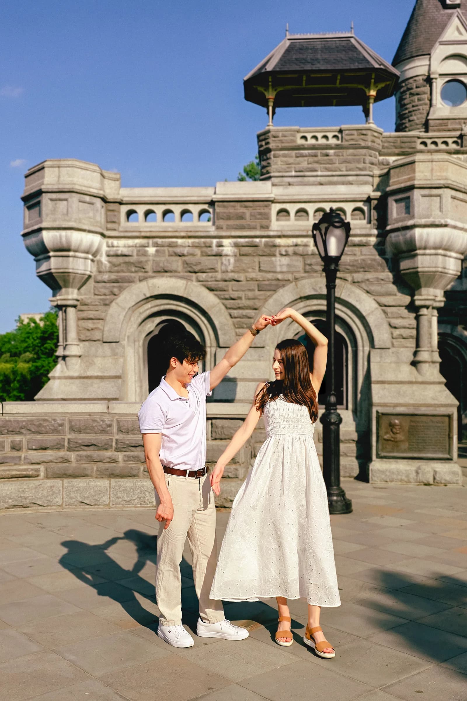 The couple sharing a tall portrait outdoors