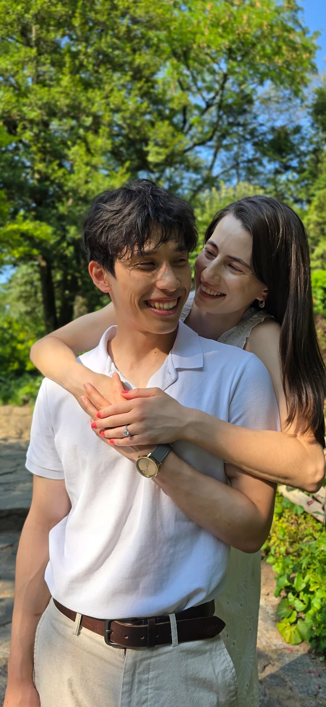 The couple together in a bright vertical portrait