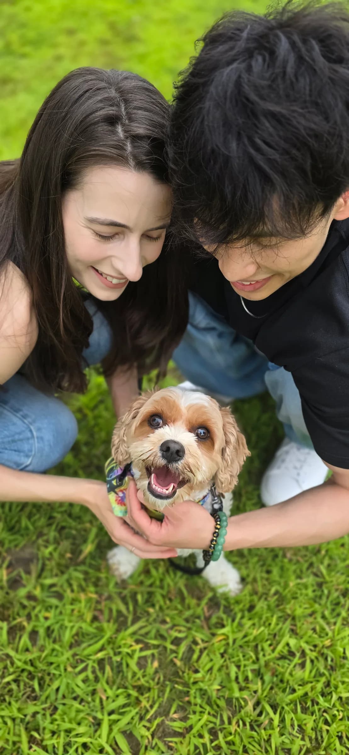 The couple sharing a joyful outdoor moment