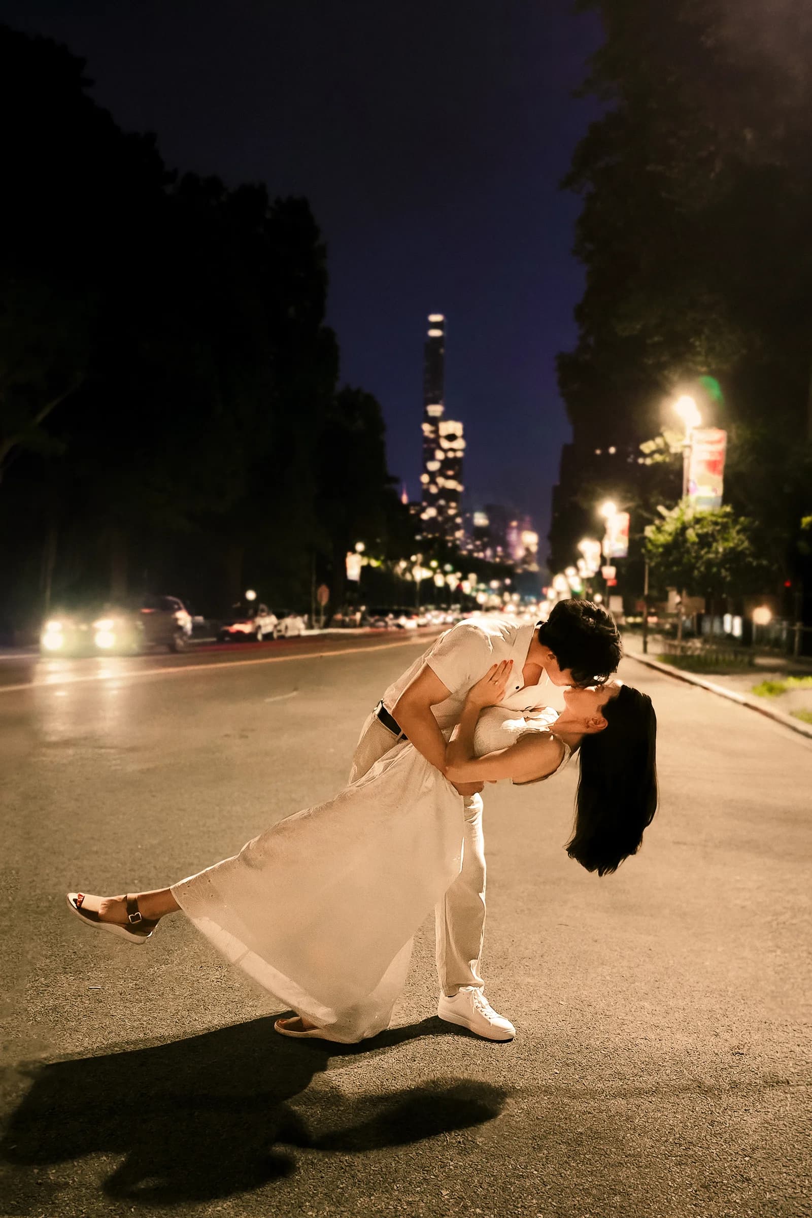The couple sharing a tall outdoor portrait